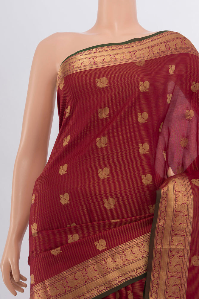 Border image of Maroon Kanchipuram Silk Saree with Zari Butta on the body and Silk Border. 