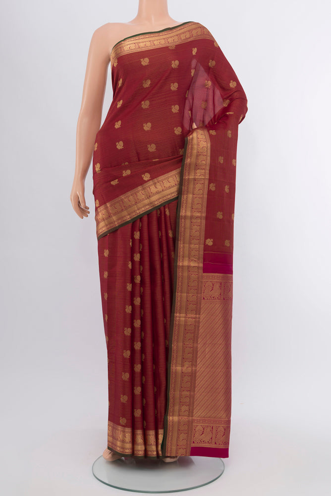 Maroon Kanchipuram Silk Saree with Zari Butta on the body and Silk Border.  displayed on a mannequin