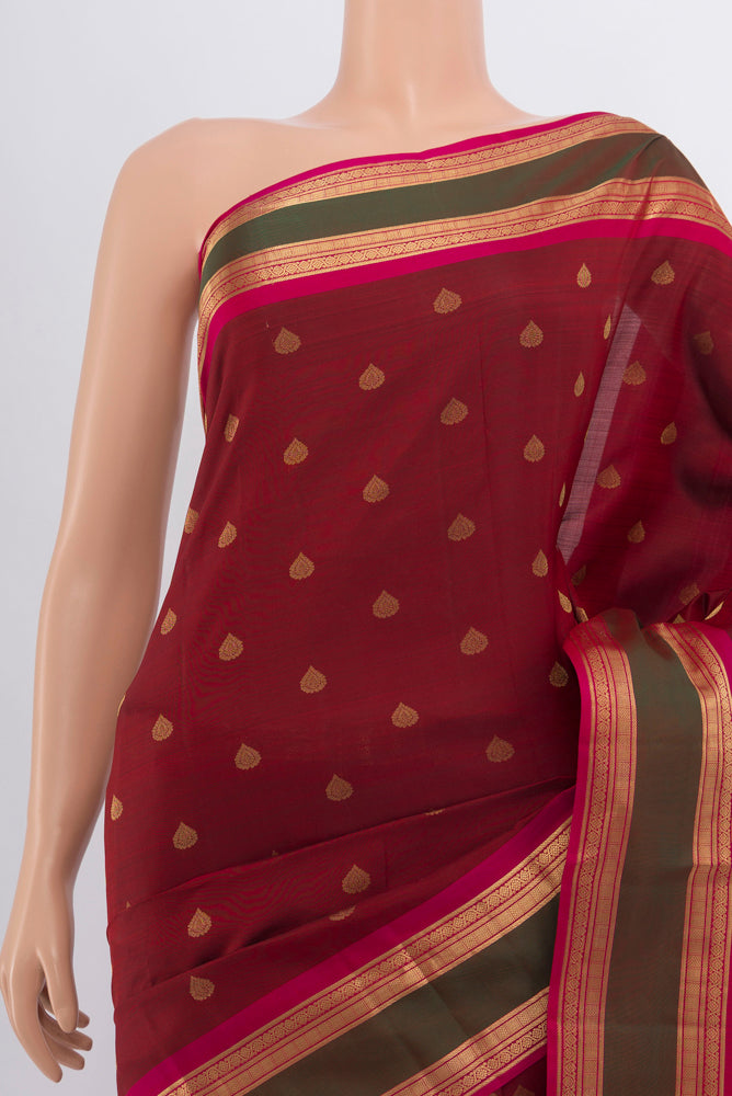 Border image of Maroon Kanchipuram Silk Saree with Zari Butta on the body and Silk Border. 