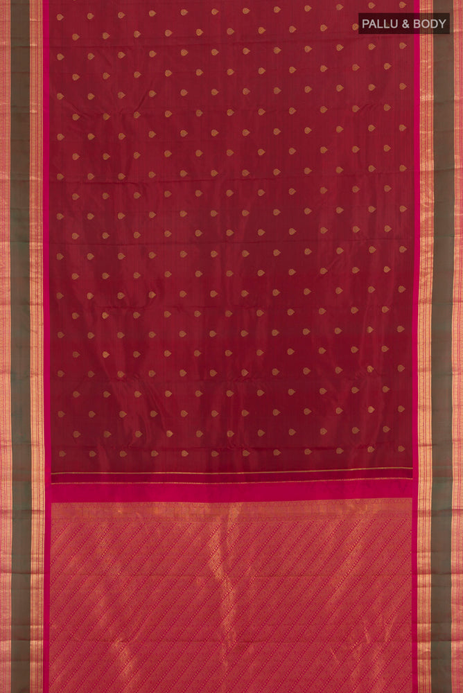 Flat view of Maroon Kanchipuram Silk Saree with Zari Butta on the body and Silk Border. 