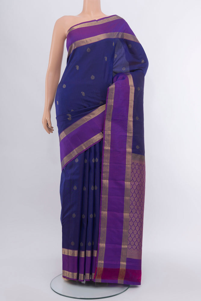 Navy Blue Kanchipuram Silk Saree with Zari Butta on the body and Silk Border.  displayed on a mannequin