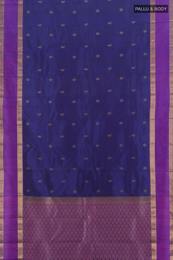 Flat view of Navy Blue Kanchipuram Silk Saree with Zari Butta on the body and Silk Border. 