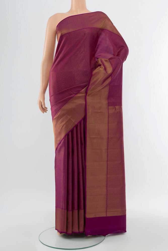 Purple Kanchipuram Silk Saree with Zari Butta on the body and Silk Border.  displayed on a mannequin