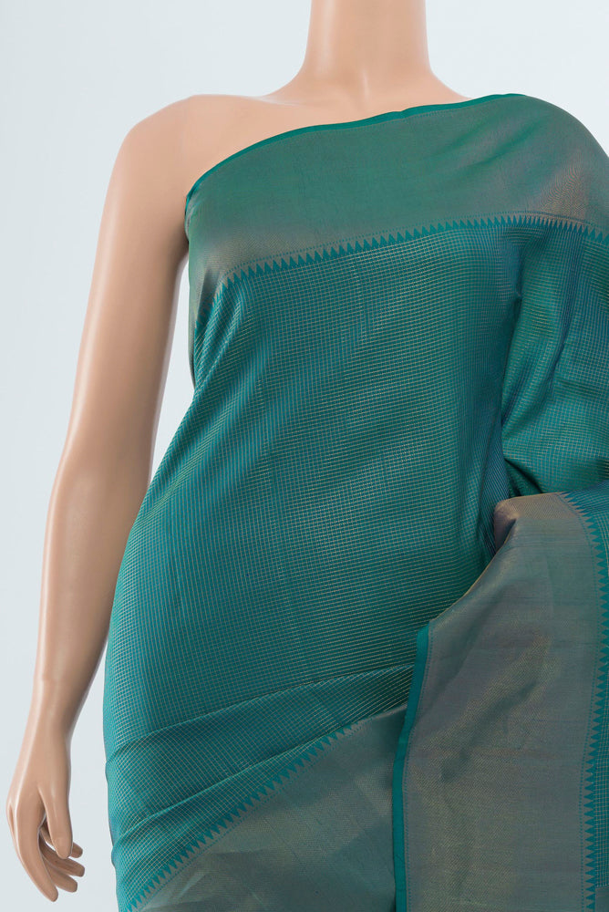 Border image of Peacock Blue Kanchipuram Silk Saree with Zari Butta on the body and Silk Border. 