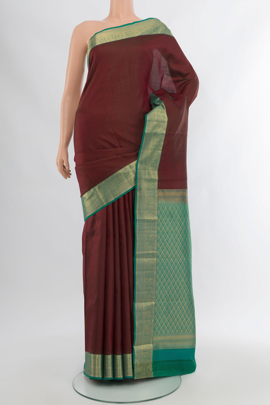 Coffee Brown Kanchipuram Silk Saree with Zari Butta on the body and Silk Border.  displayed on a mannequin