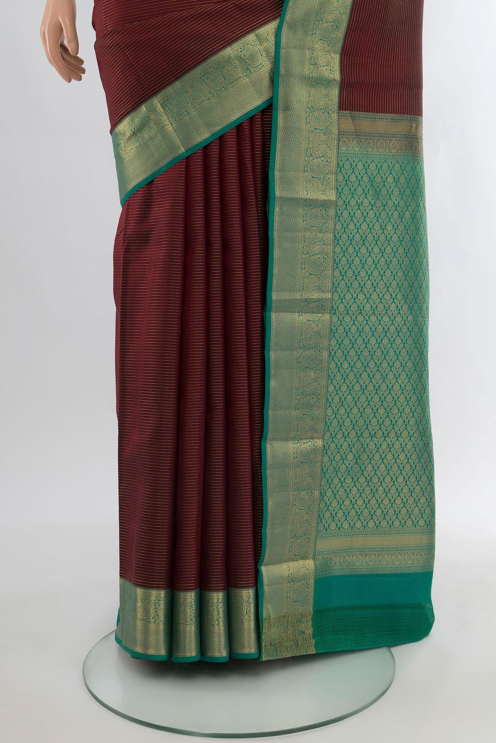 Pleats and pallu of Coffee Brown Kanchipuram Silk Saree with Zari Butta on the body and Silk Border. 