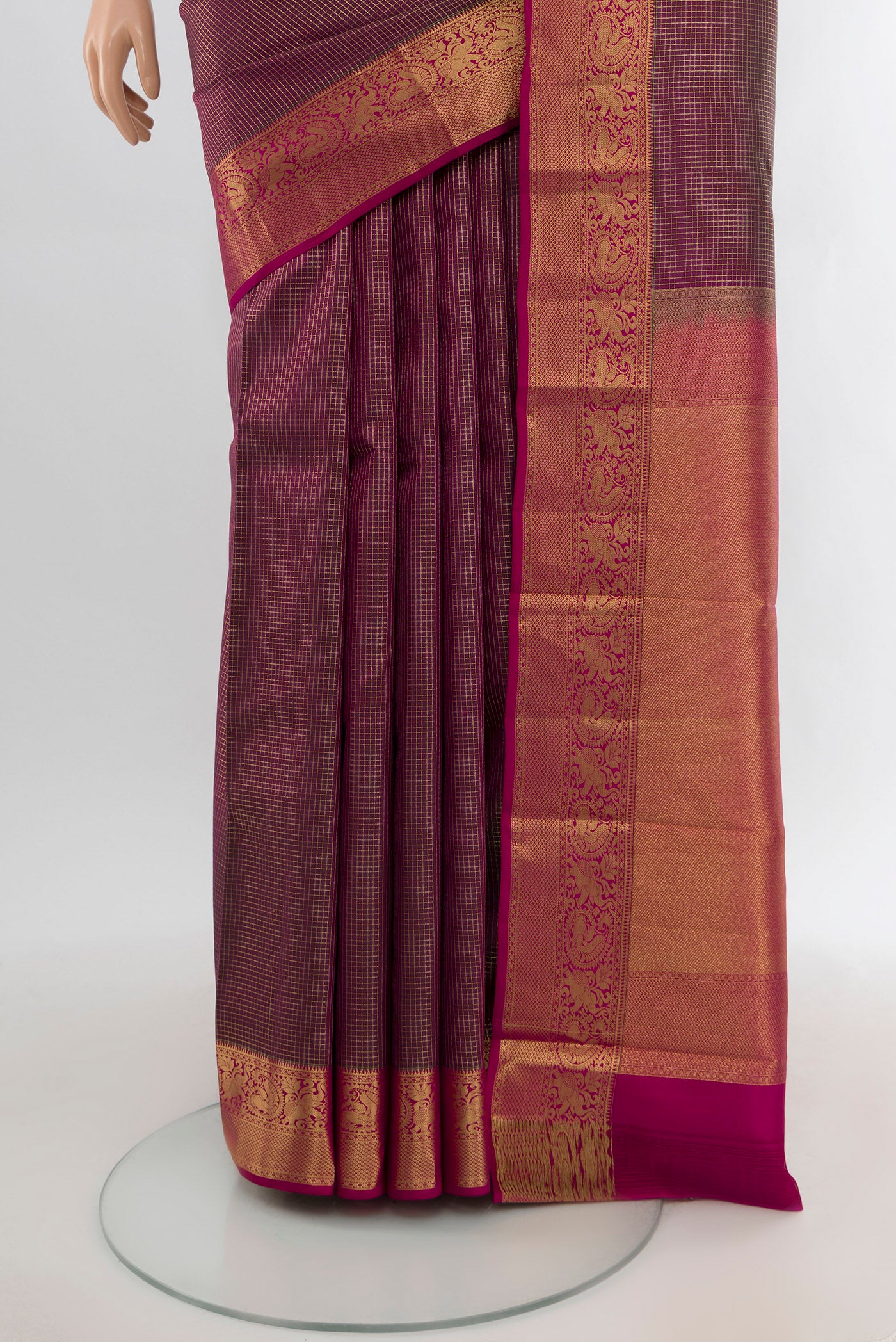 Pleats and pallu of Purple Kanchipuram Silk Saree with Checked design on the body and Zari Border. 