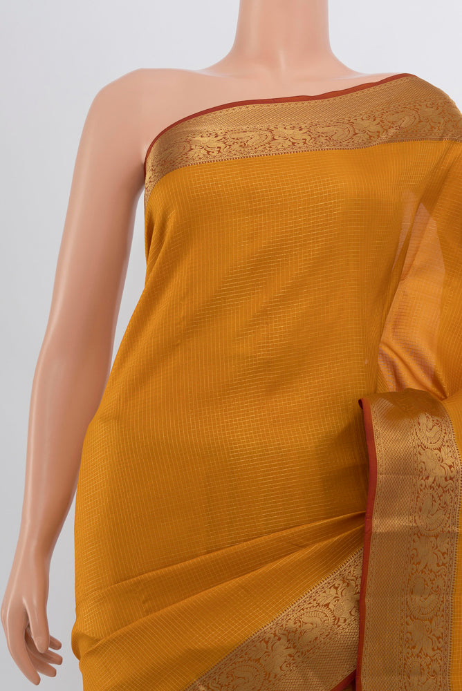 Border image of Mustard Kanchipuram Silk Saree with Zari Butta on the body and Silk Border. 