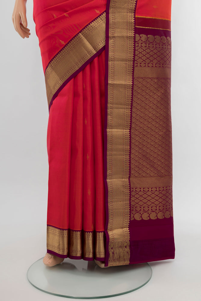 Pleats and pallu of Peach Kanchipuram Silk Saree with Plain Body and Silk Border. 