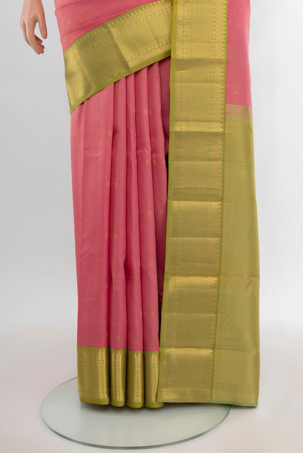 Pleats and pallu of Rose pink Kanjivaram Silk Saree with Zari Butta on the body and Zari Border. 