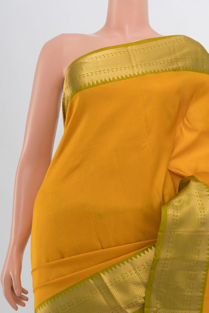 Border image of Yellow Kanjivaram Silk Saree with Zari Butta on the body and Silk Border. 