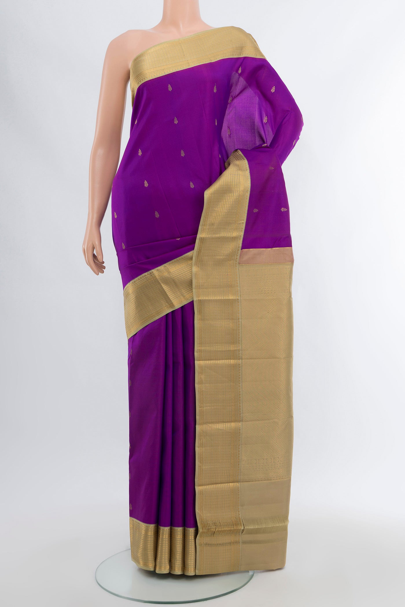 Violet Kanchipuram Silk Saree with Zari Butta on the body and Silk Border.  displayed on a mannequin