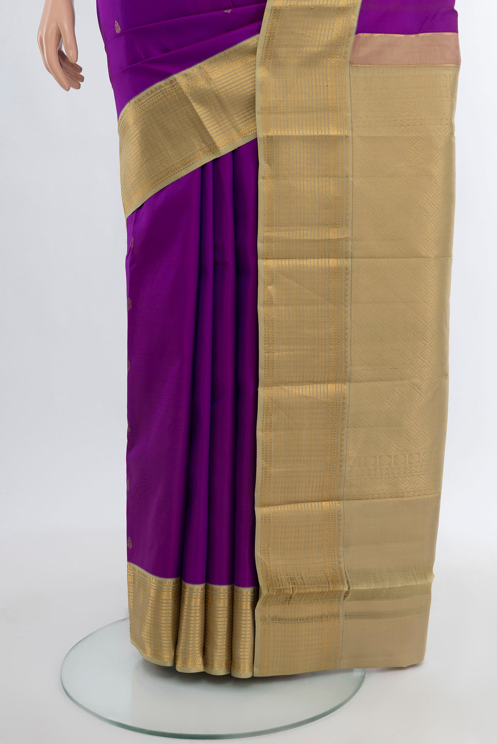 Pleats and pallu of Violet Kanchipuram Silk Saree with Zari Butta on the body and Silk Border. 