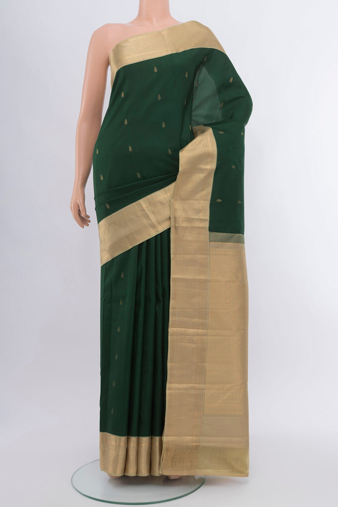Bottle Green Kanchipuram Silk Saree with Checked design on the body and Silk Border.  displayed on a mannequin