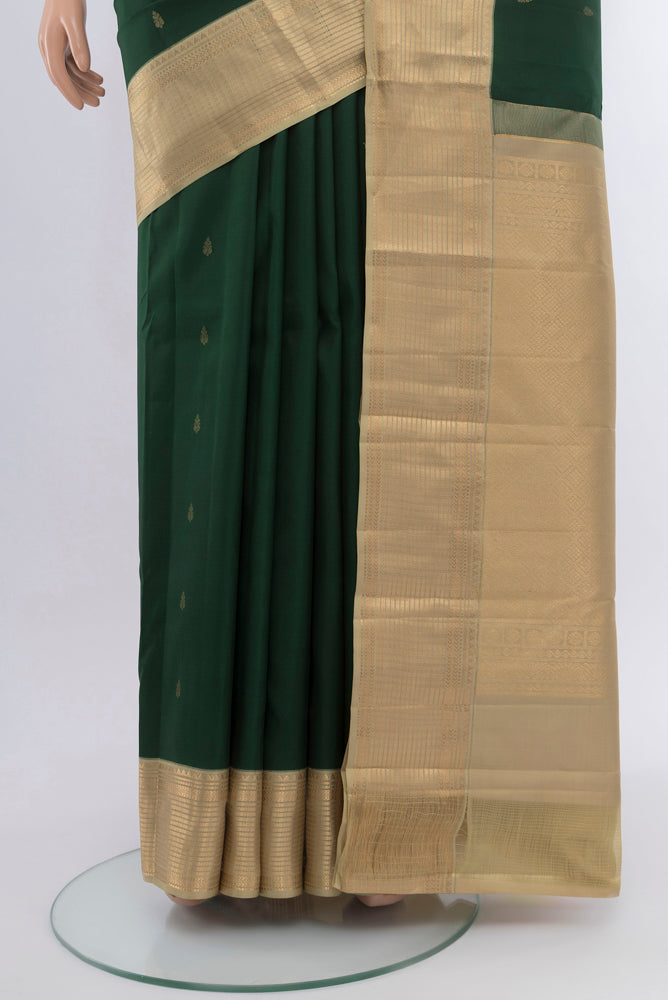 Pleats and pallu of Bottle Green Kanchipuram Silk Saree with Checked design on the body and Silk Border. 