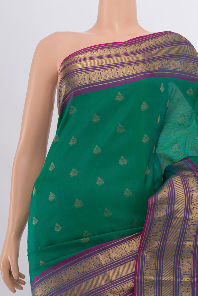 Border image of Peacock Blue Kanchipuram Silk Saree with Zari Butta on the body and Silk Border. 