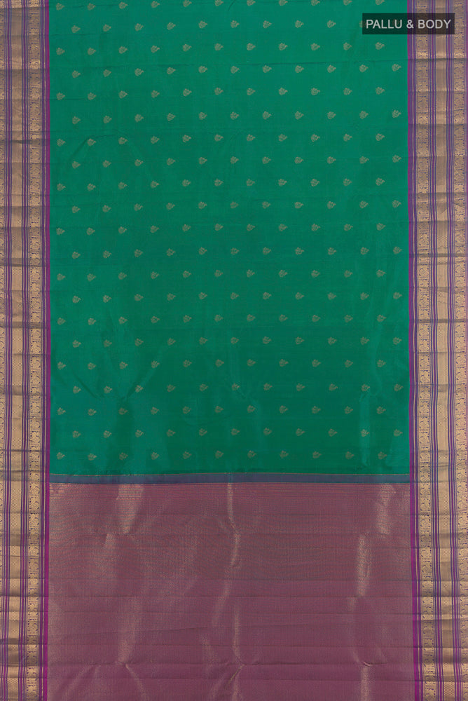 Flat view of Peacock Blue Kanchipuram Silk Saree with Zari Butta on the body and Silk Border. 