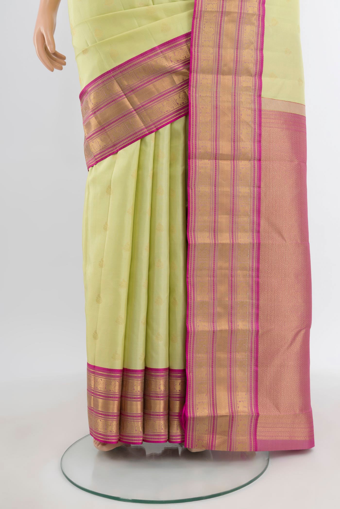 Pleats and pallu of Pista Green Kanchipuram Silk Saree with Zari Butta on the body and Zari Border. 