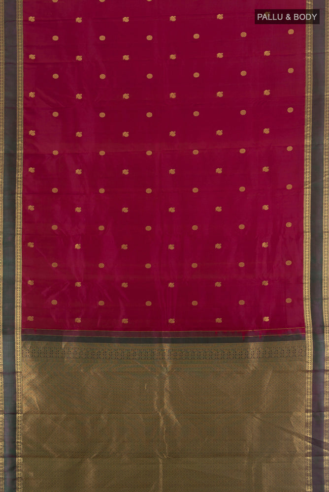 Flat view of Purple Kanchipuram Silk Saree with Zari Butta on the body and Silk Border. 