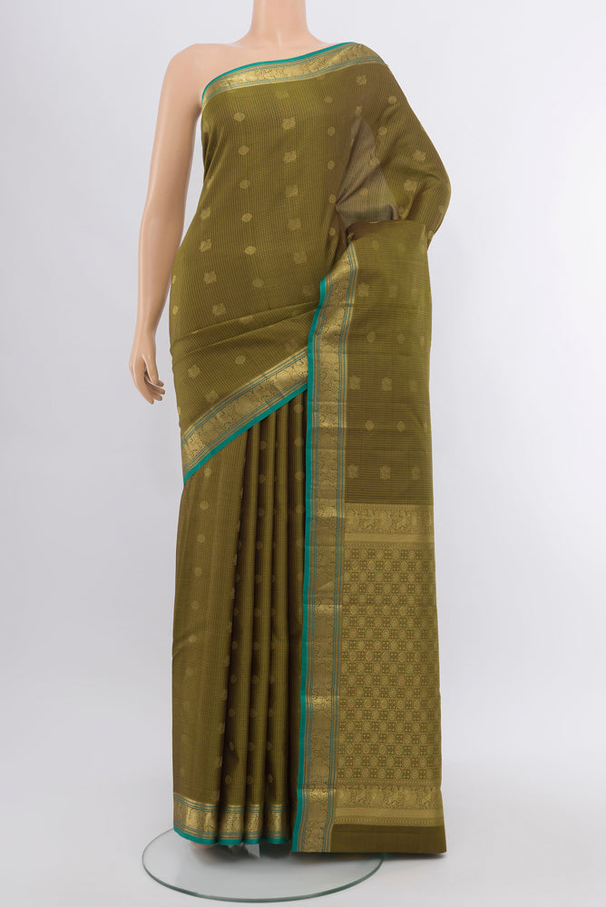 Mehandi Green Kanchipuram Silk Saree with Zari Butta on the body and Silk Border.  displayed on a mannequin