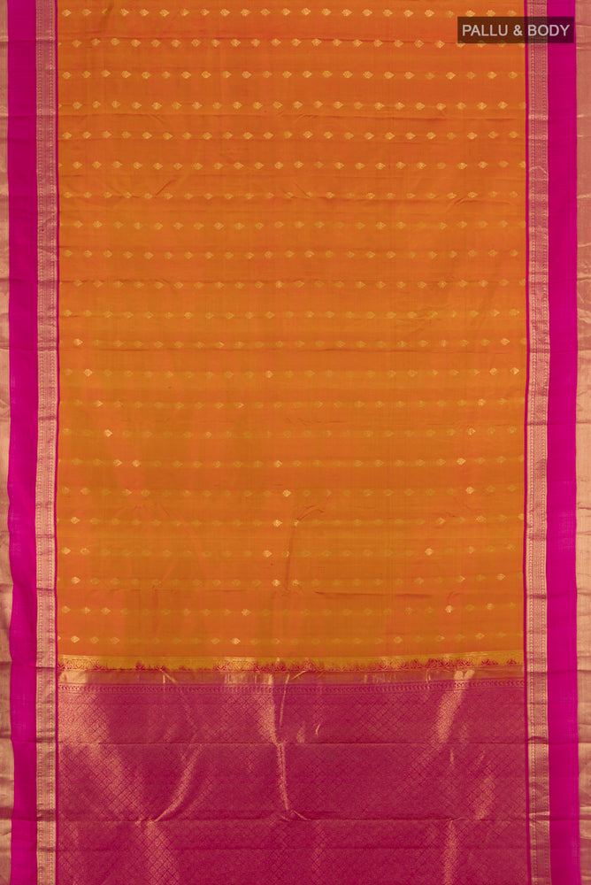 Flat view of Golden Peach Kanchipuram Silk Saree with Zari Butta on the body and Silk Border. 