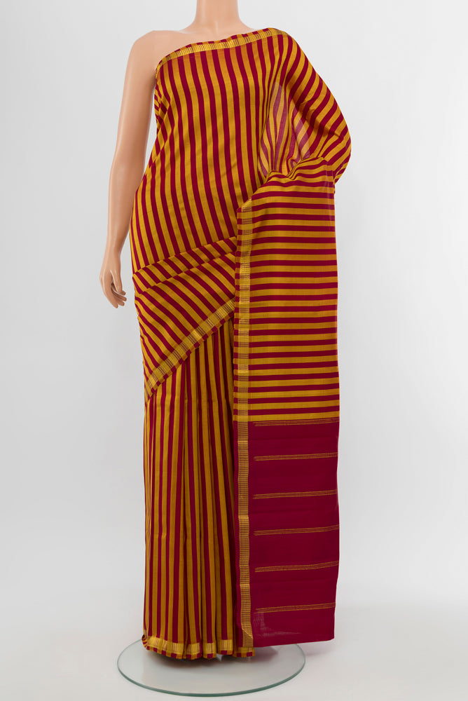 Multi Color Kanchipuram Silk Saree with Checked design on the body and Silk Border.  displayed on a mannequin