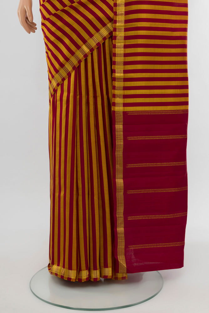 Pleats and pallu of Multi Color Kanchipuram Silk Saree with Checked design on the body and Silk Border. 