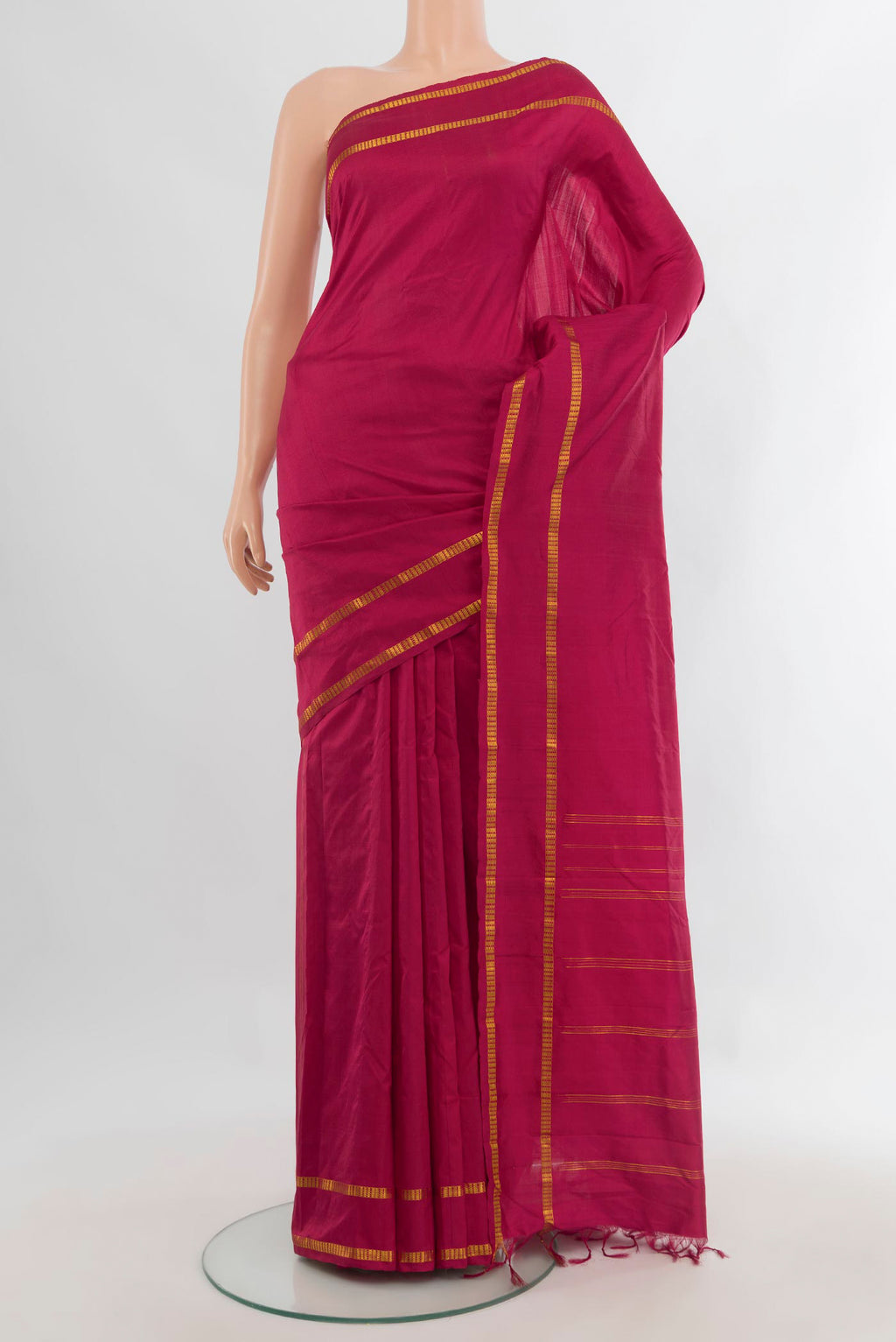 Pure Silk Maroon Kanchipuram Saree with Plain Body and Zari Border.  displayed on a mannequin