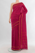 Pure Silk Maroon Kanchipuram Saree with Plain Body and Zari Border.  displayed on a mannequin