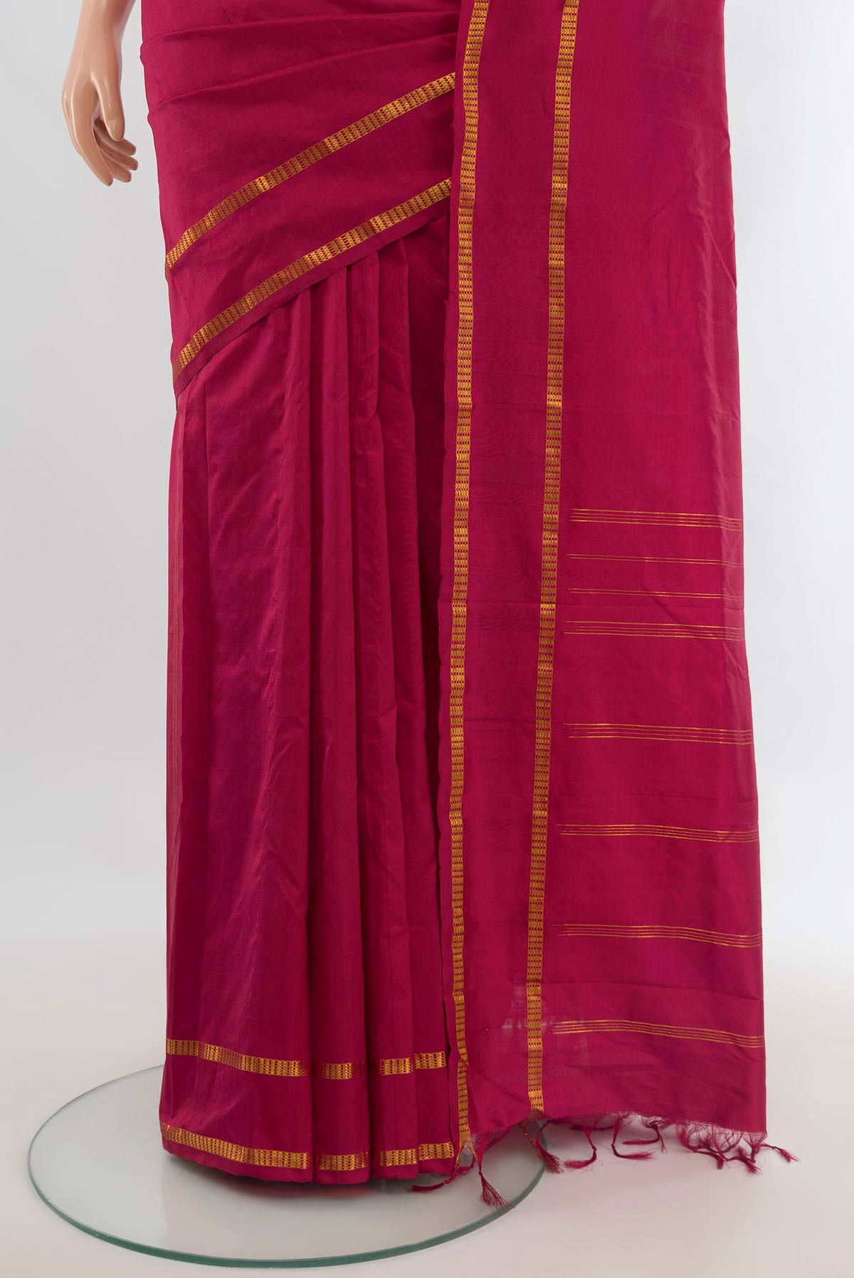 Pleats and pallu of Pure Silk Maroon Kanchipuram Saree with Plain Body and Zari Border. 
