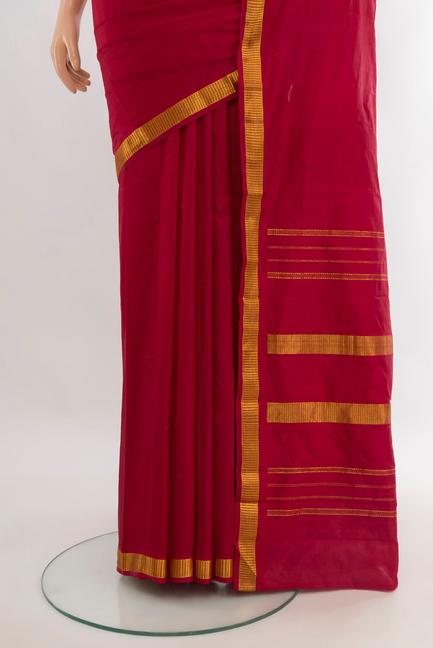 Pleats and pallu of Maroon Kanjivaram Silk Saree with Plain Body and Zari Border. 