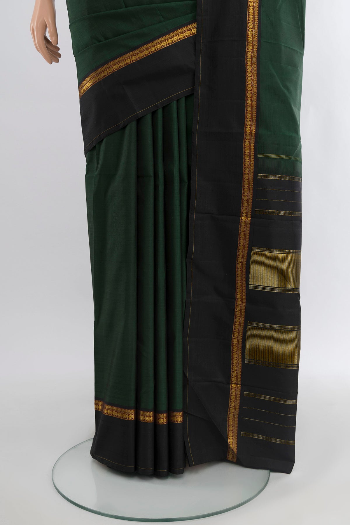 Pleats and pallu of Bottle Green Kanchipuram Silk Saree with Plain Body and Plain Border. 