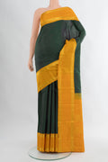 Bottle Green Kanjivaram Silk Saree with Plain Body and Zari Border.  displayed on a mannequin