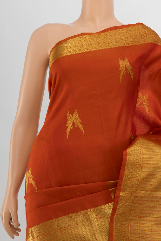 Border image of Brick Orange Kanjivaram Silk Saree with Zari Butta on the body and Silk Border. 