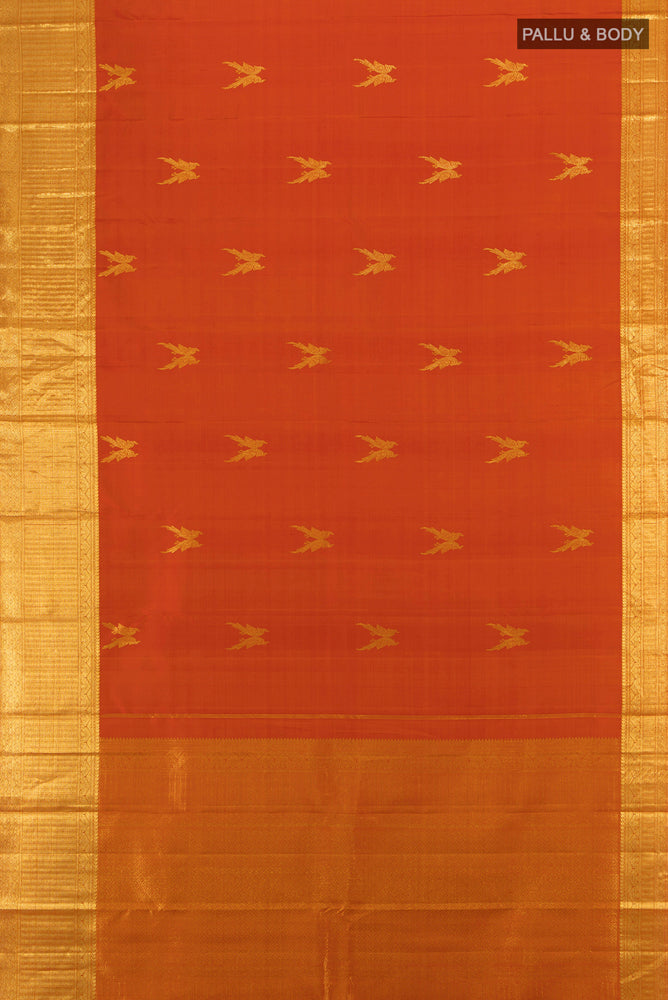 Flat view of Brick Orange Kanjivaram Silk Saree with Zari Butta on the body and Silk Border. 