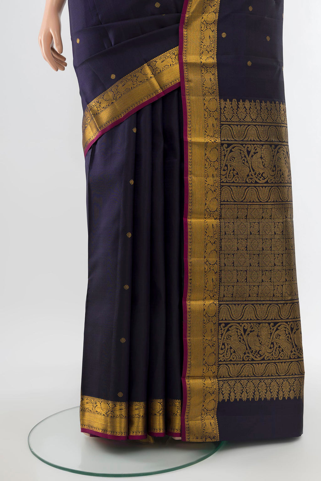 Pleats and pallu of Pure Silk Pure Zari Navy Blue Kanjivaram Saree with Zari Butta on the body and Silk Border. 