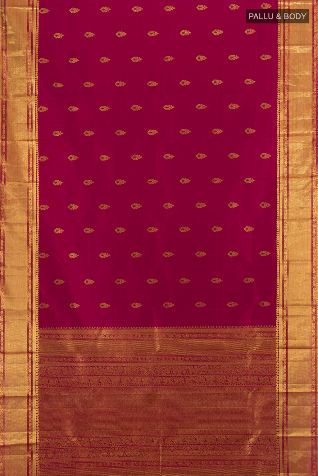 Flat view of Maroon Kanjivaram Silk Saree with Zari Butta on the body and Zari Border. 