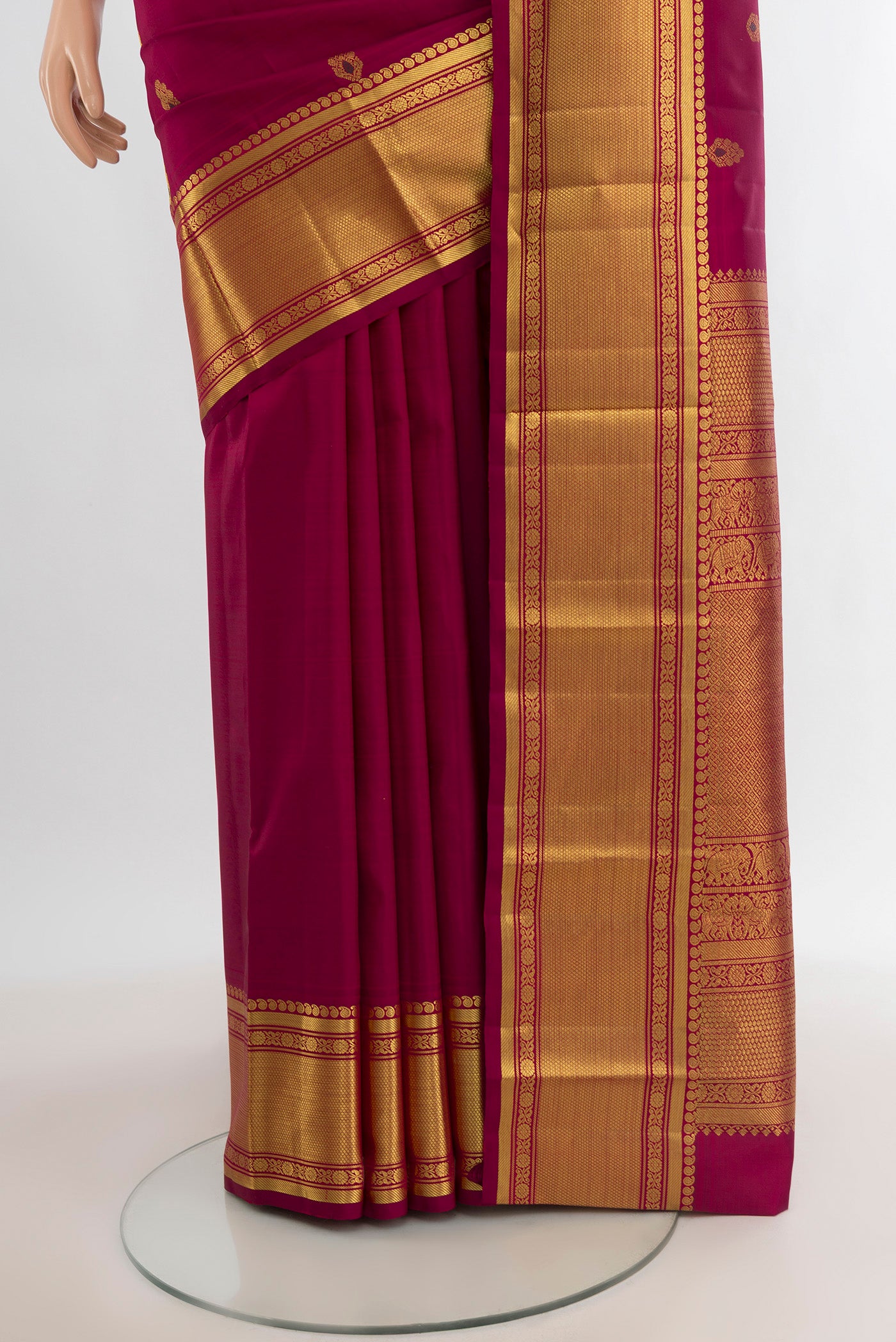 Pleats and pallu of Maroon Kanjivaram Silk Saree with Zari Butta on the body and Zari Border. 