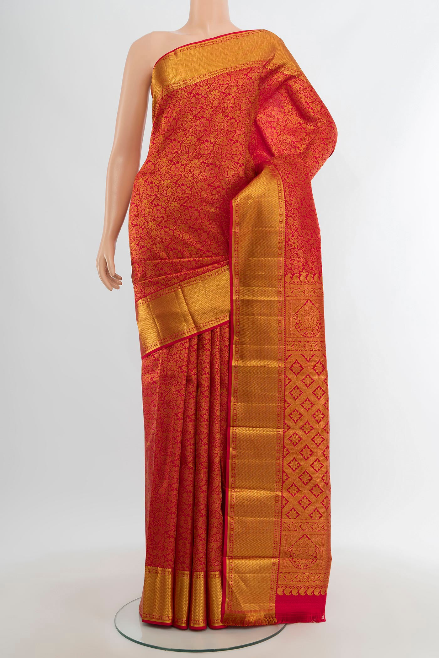 Red Kanjivaram Silk Saree with Zari Brocade on the body and Zari Border.  displayed on a mannequin