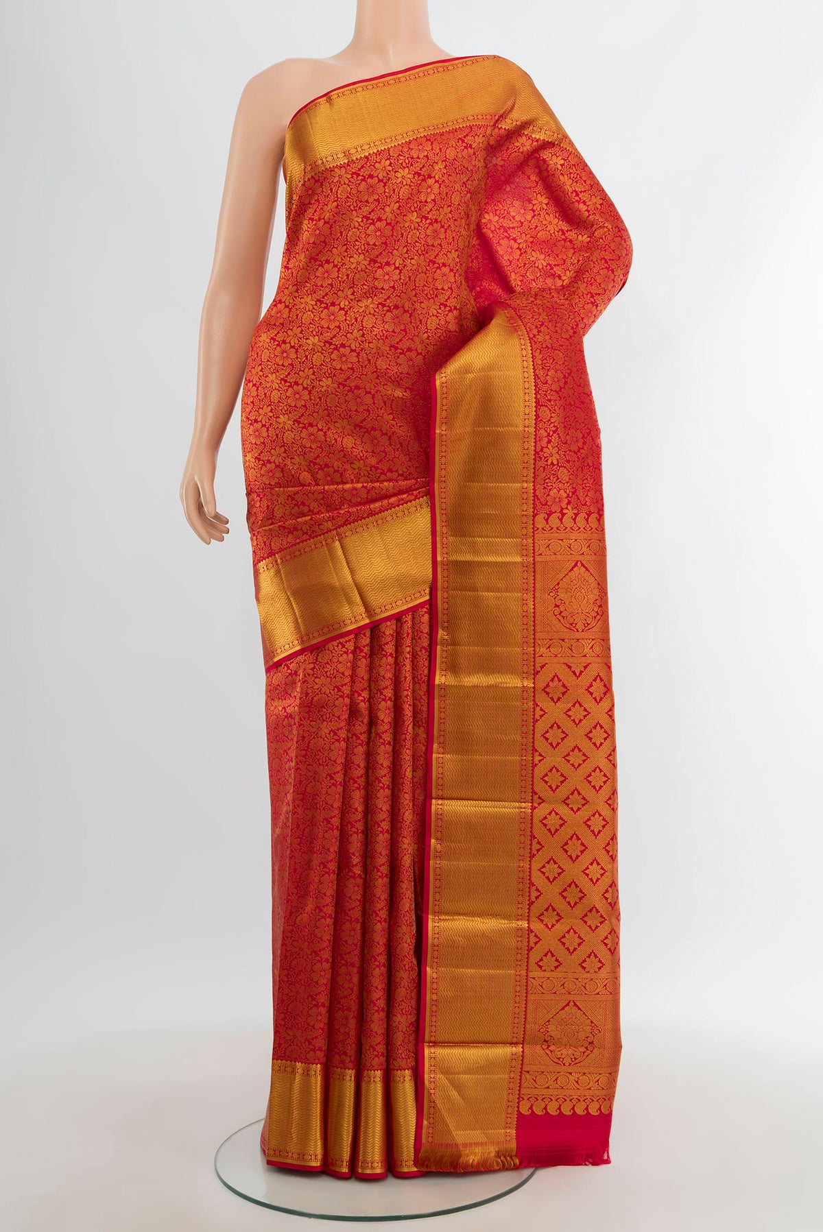 Red Kanjivaram Silk Saree with Zari Brocade on the body and Zari Border.  displayed on a mannequin