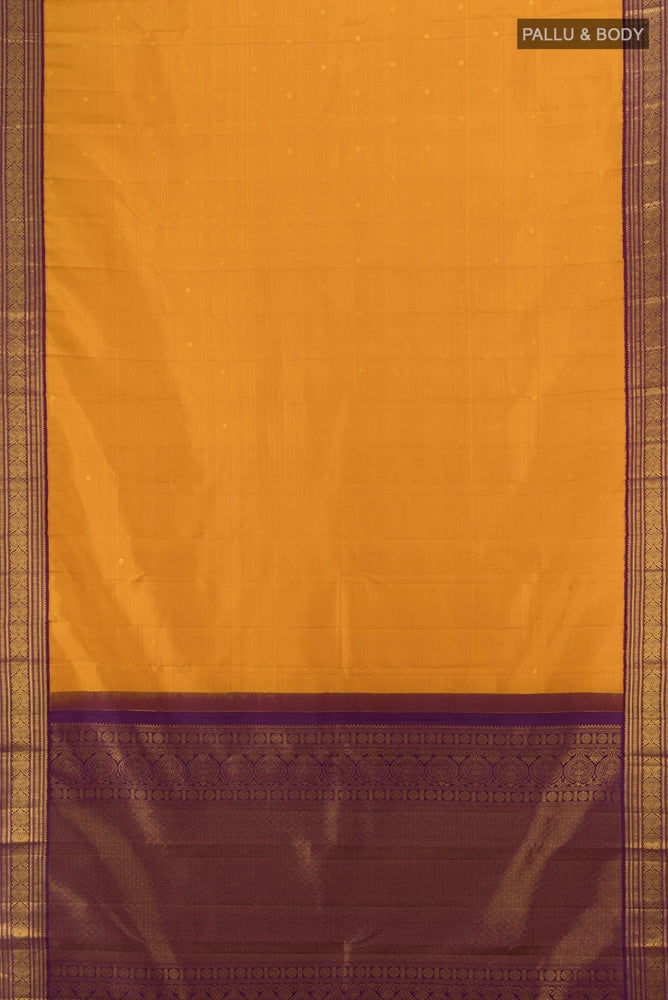 Flat view of Mustard Kanjivaram Silk Saree with Zari Butta on the body and Silk Border. 