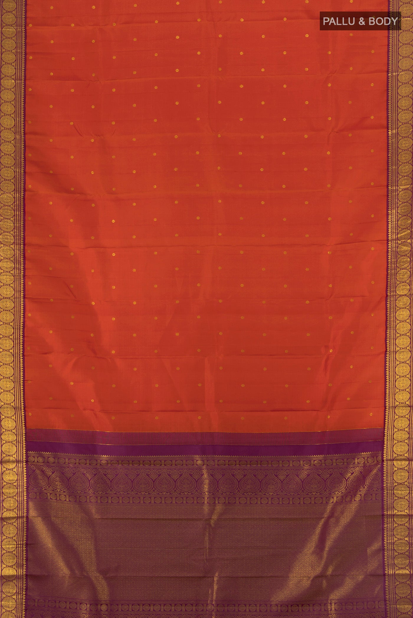 Flat view of Rust Kanjivaram Silk Saree with Zari Butta on the body and Zari Border. 