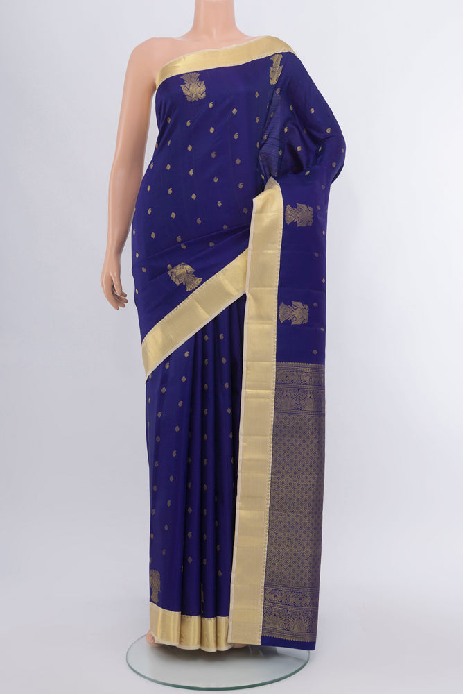 Dark Blue Kanjivaram Silk Saree with Zari Butta on the body and Silk Border.  displayed on a mannequin