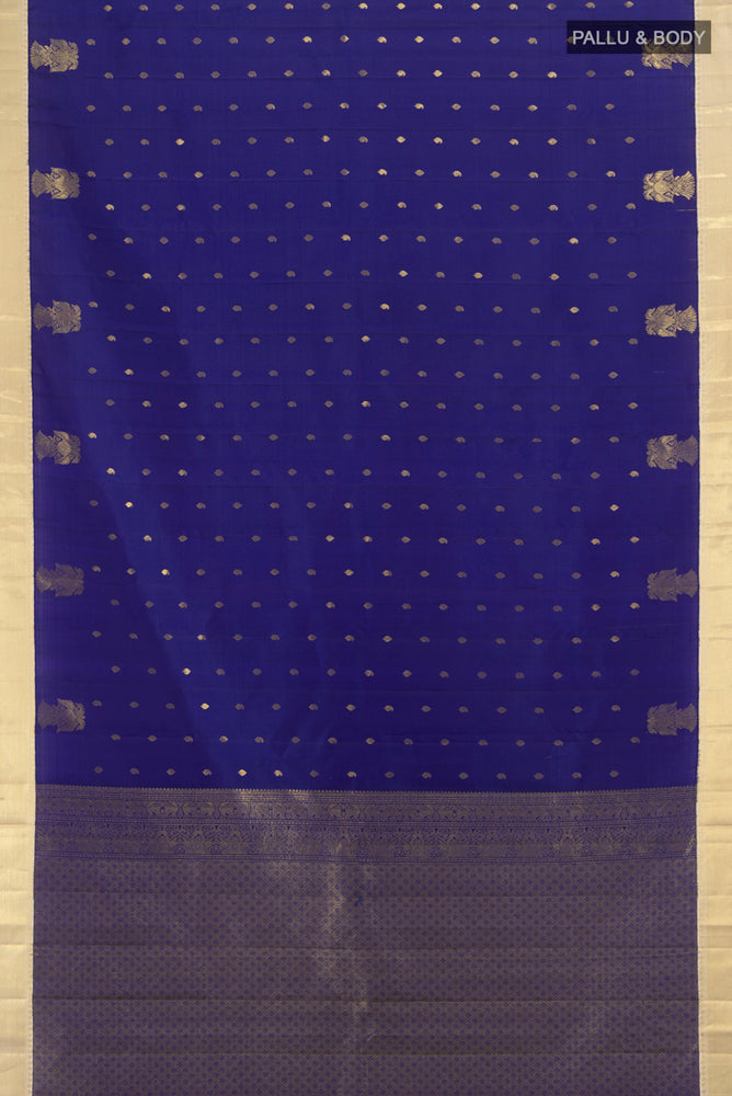 Flat view of Dark Blue Kanjivaram Silk Saree with Zari Butta on the body and Silk Border. 