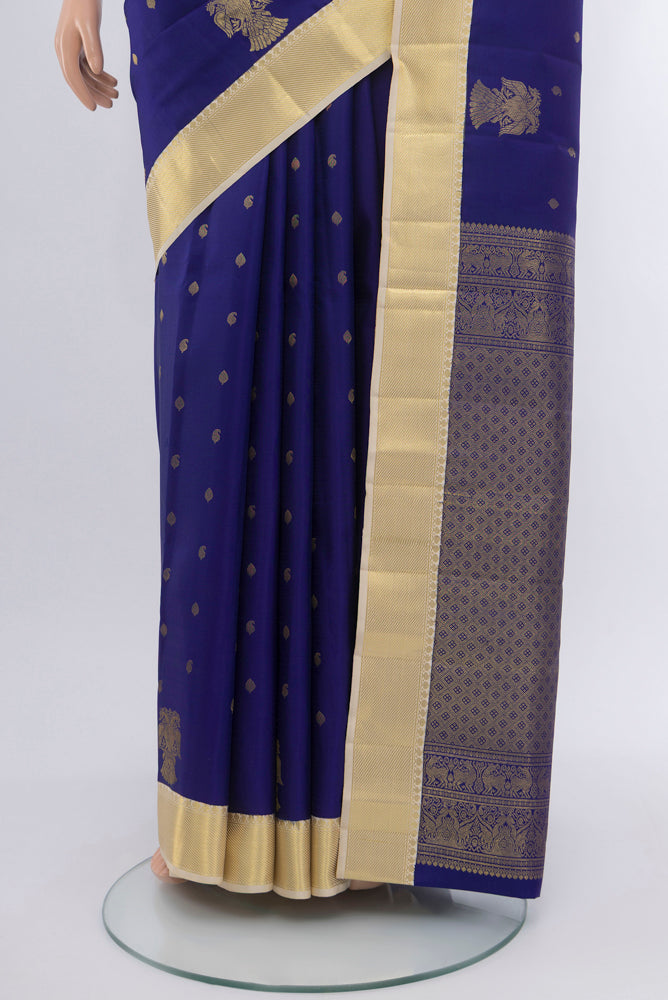 Pleats and pallu of Dark Blue Kanjivaram Silk Saree with Zari Butta on the body and Silk Border. 
