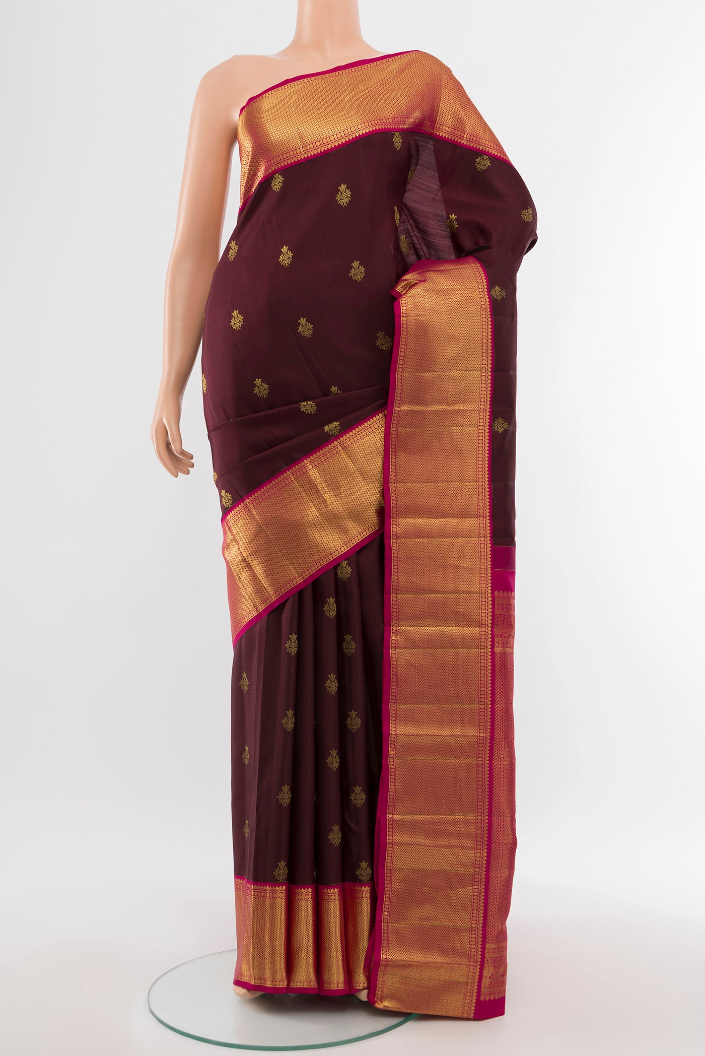Coffee Brown Kanjivaram Silk Saree with Zari Butta on the body and Silk Border.  displayed on a mannequin