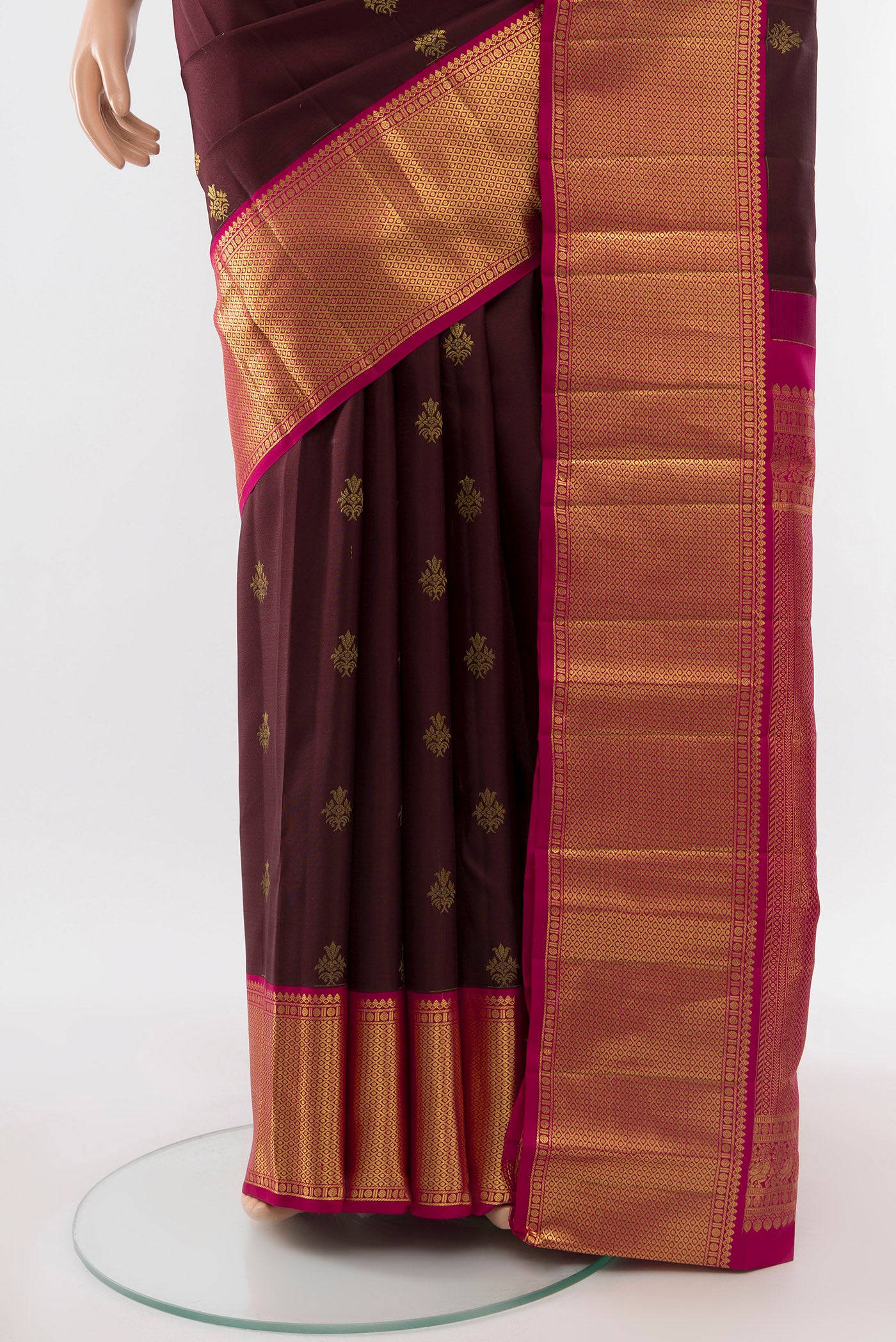 Pleats and pallu of Coffee Brown Kanjivaram Silk Saree with Zari Butta on the body and Silk Border. 