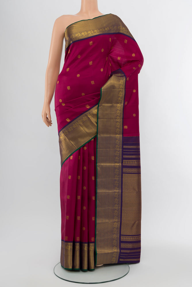 Purple Kanjivaram Silk Saree with Zari Butta on the body and Silk Border.  displayed on a mannequin