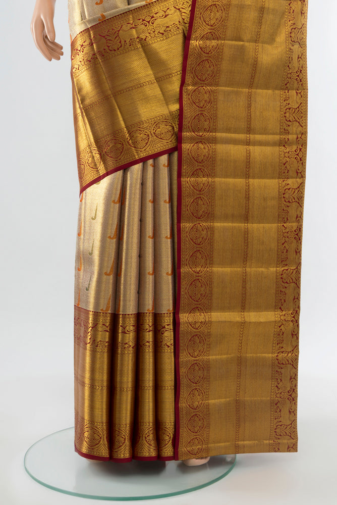 Pleats and pallu of Golden Kanjivaram Silk Saree with Zari Butta on the body and Silk Border. 