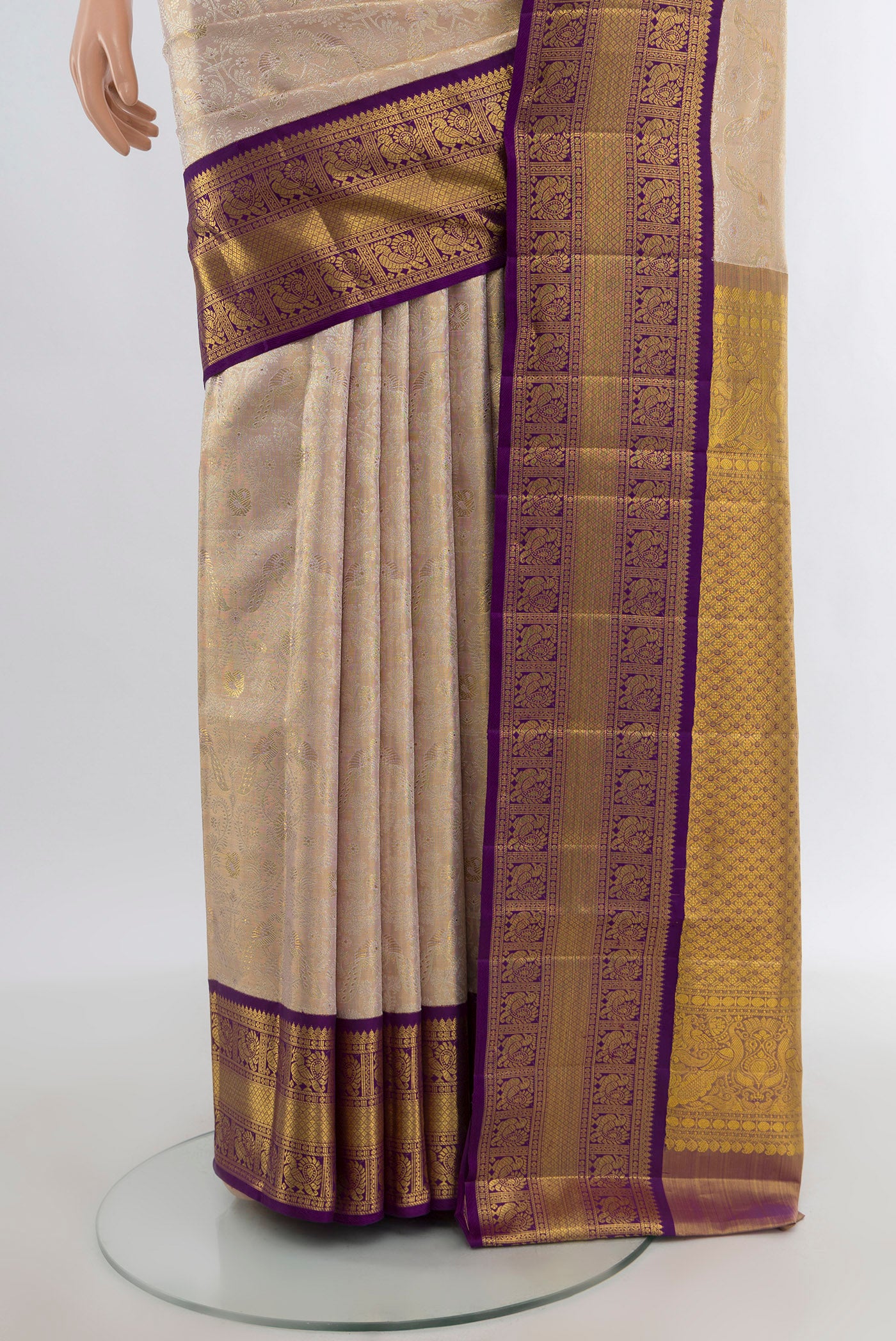 Pleats and pallu of Cream Kanjivaram Tissue Silk Saree with Zari Brocade on the body and Zari Border. 